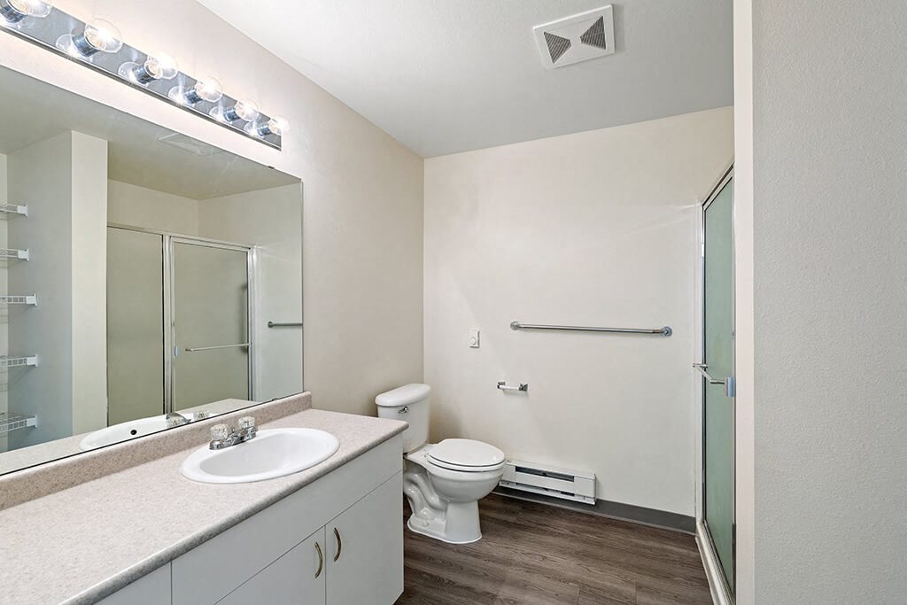 Bathroom with sink and shower at Ballinger Court Senior Apartments in Edmonds WA